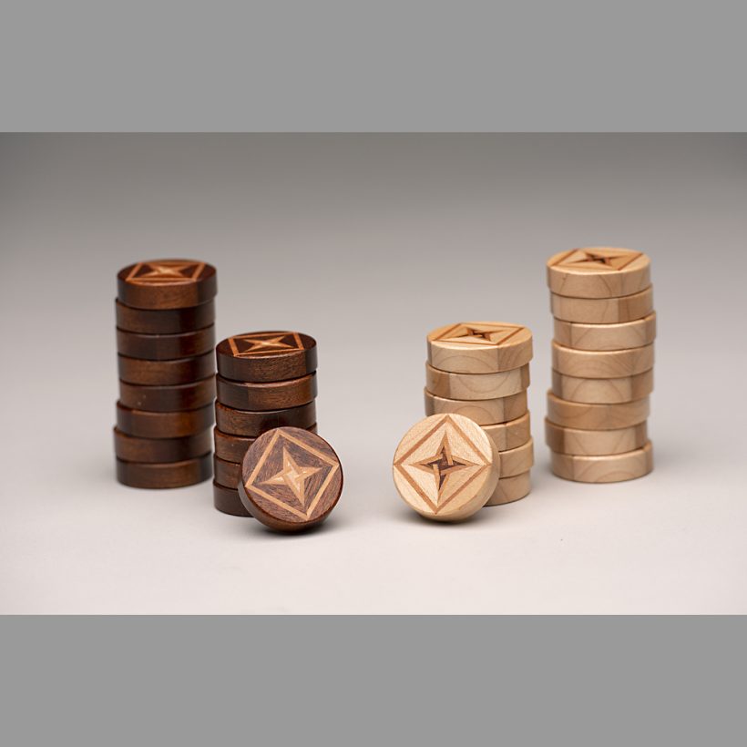 Stacked backgammon pieces Stacked backgammon pieces