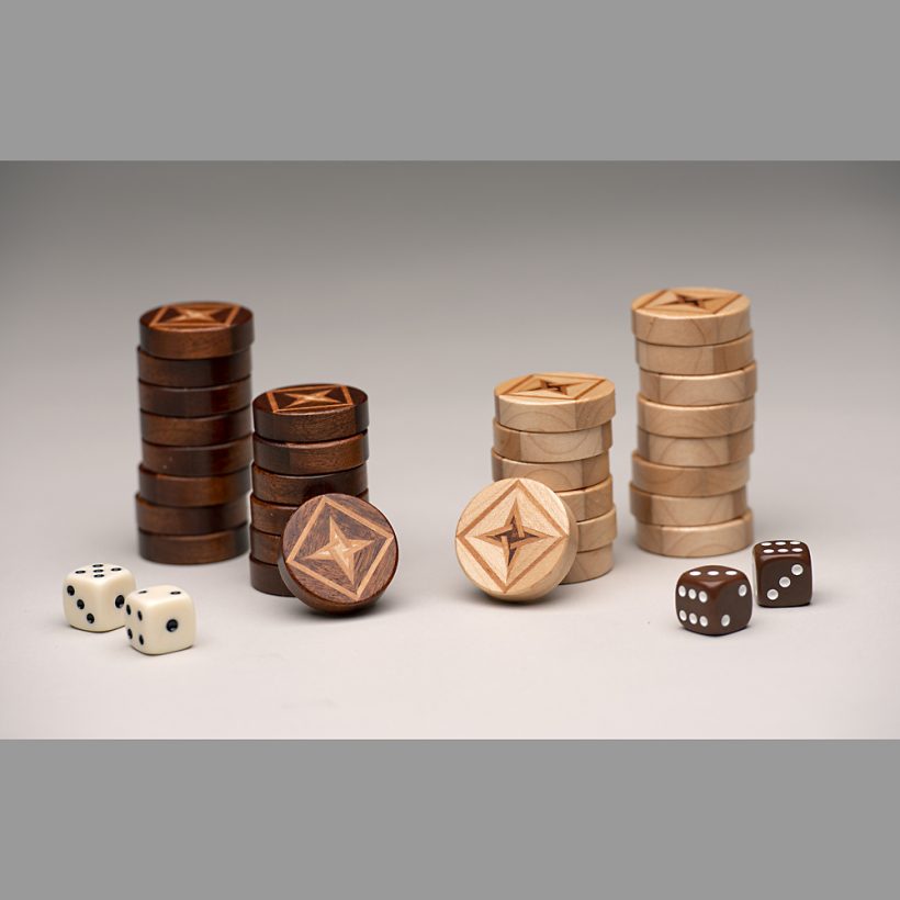 Stacked backgammon pieces with dice Stacked backgammon pieces with dice