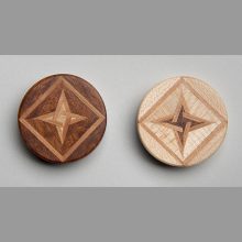 Two backgammon pieces Two backgammon pieces